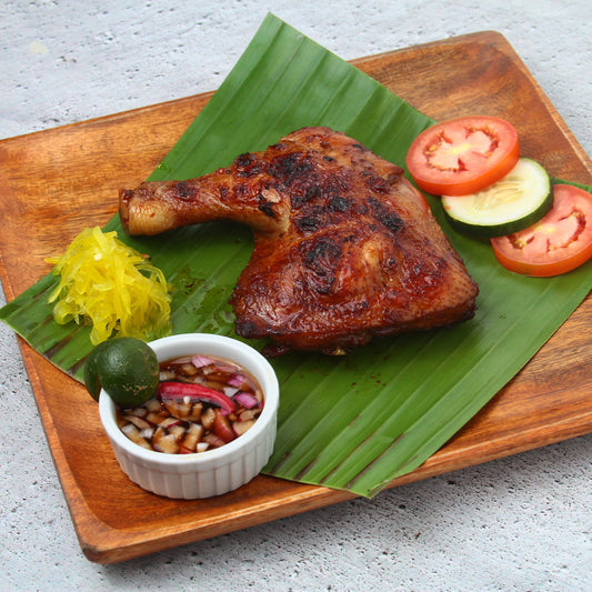 chicken inasal on a banana leaf